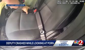 Deputy crashes car looking at porn
