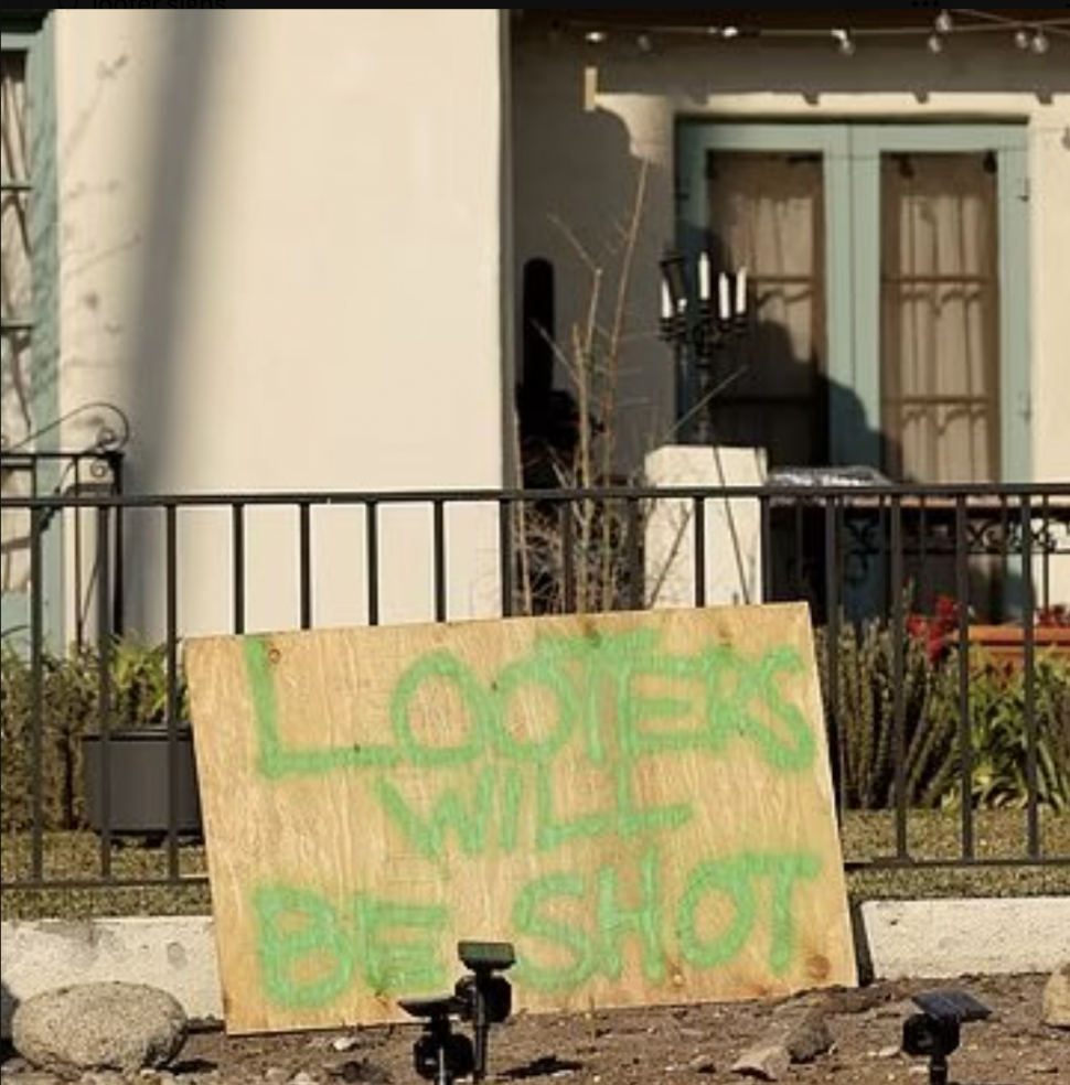 Warning signs placed in front of Los Angeles homes