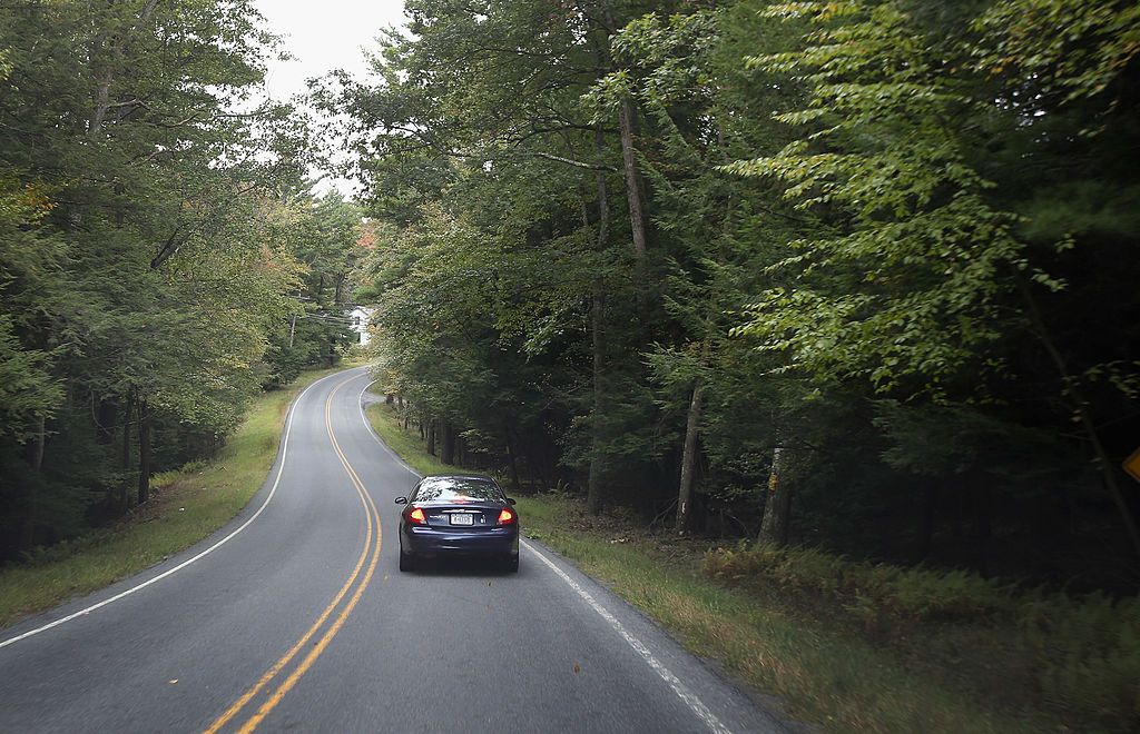 Car Driving on Meandering Rural Road 