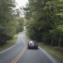 Car Driving on Meandering Rural Road