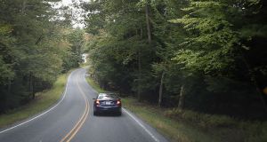Car Driving on Meandering Rural Road