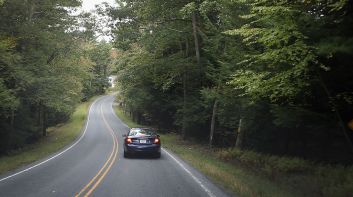 Car Driving on Meandering Rural Road