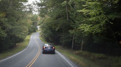 Car Driving on Meandering Rural Road